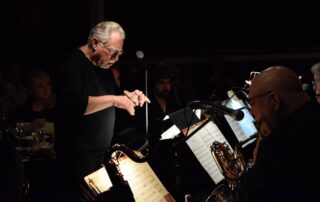 A Man Standing Behind Music Notes